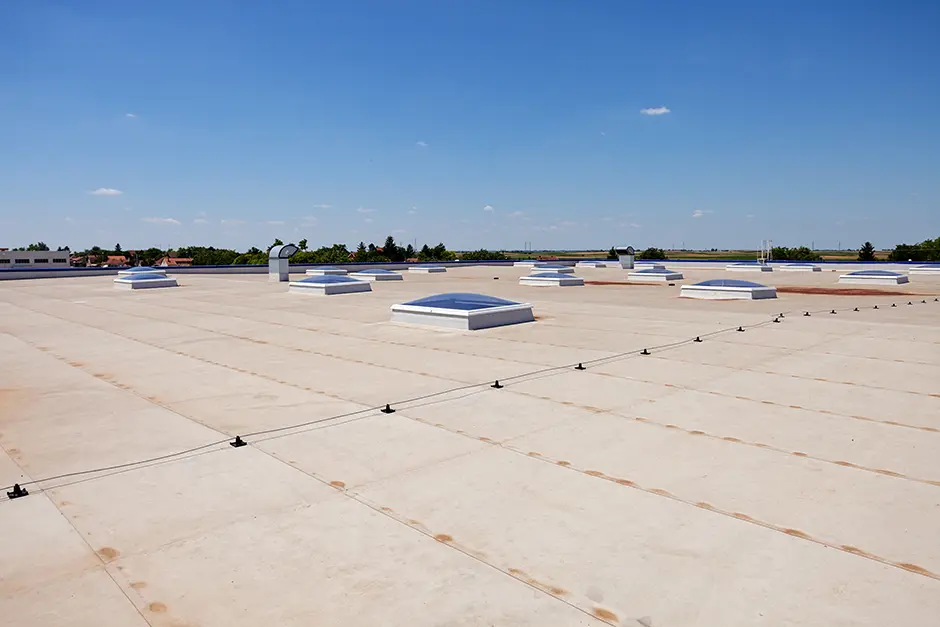commercial roof replacement and blue sky