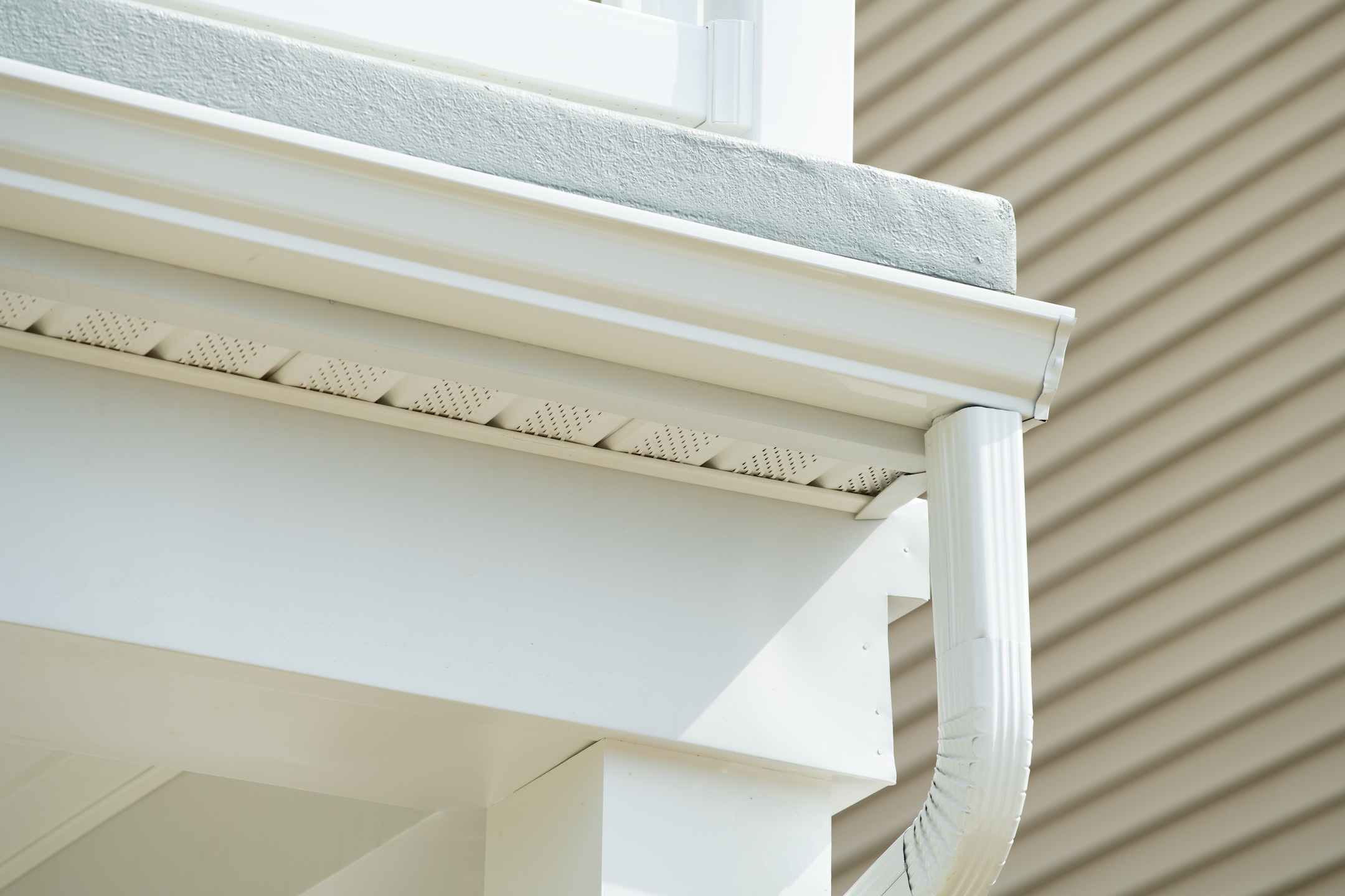 White gutter on the rooftop of house wall rain metal